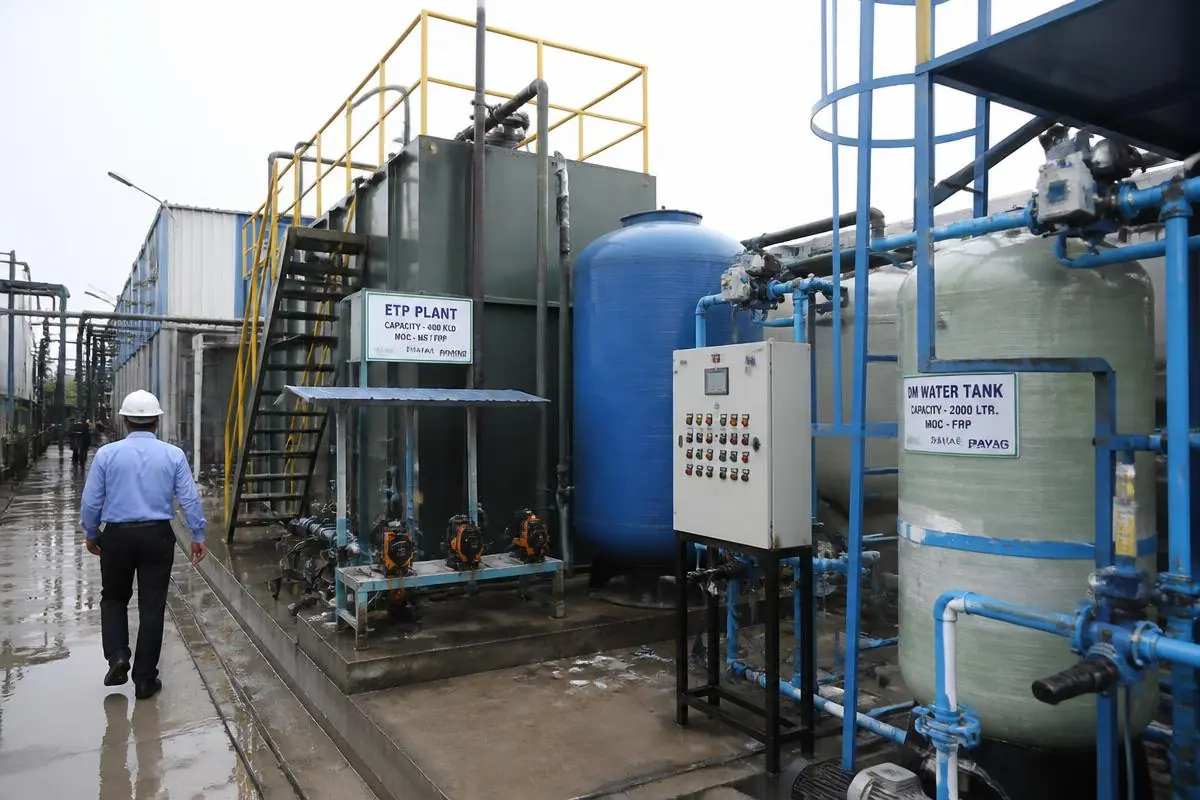Industrial effluent treatment plant with FRP tanks, dosing pumps and a control panel